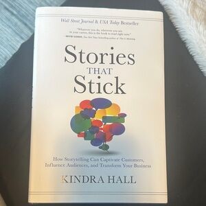 Stories That Stick by Kindra Hall - White Cover with Multicolor Graphic